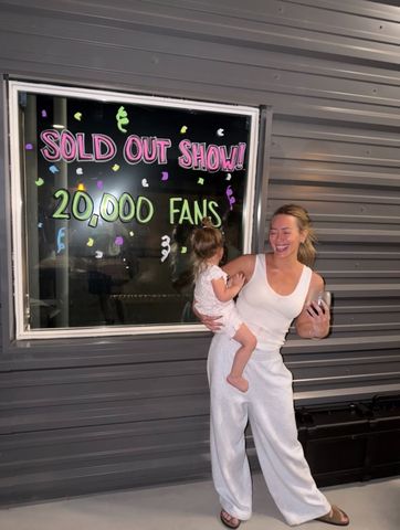 Hilary Duff goes makeup-free while holding one of her daughters in her arms