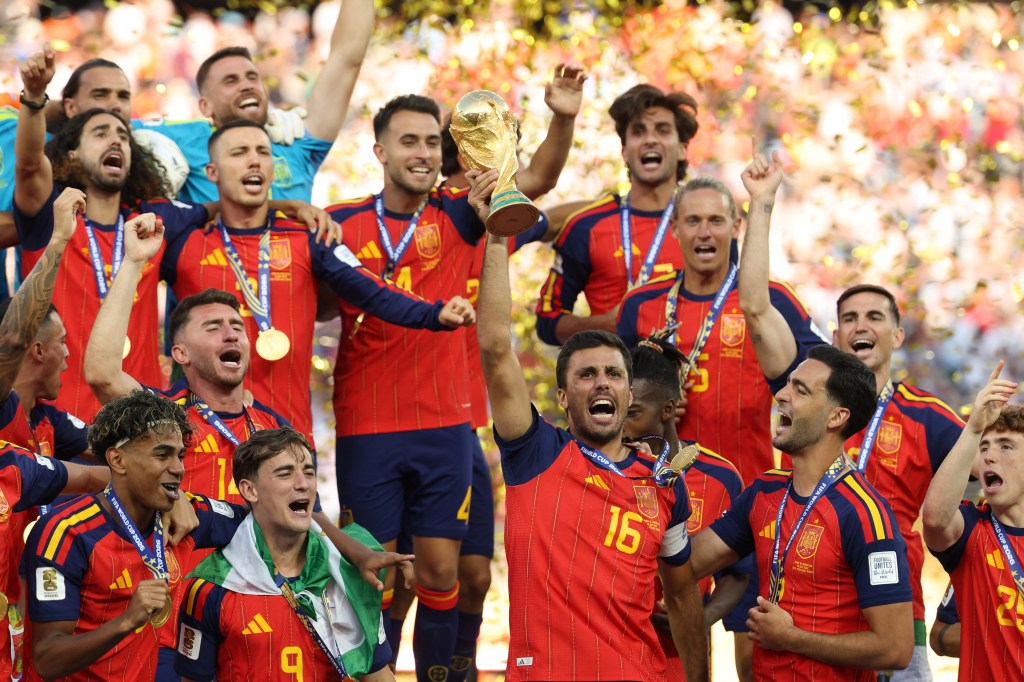 Spain's midfielder #16 Rodri lifts the trophy with his teammates after winning the 2026 World Cup football tournament final match between Spain and Argentina at the New York/New Jersey Stadium in East Rutherford on July 19, 2026. (Photo by Odd ANDERSEN / AFP via Getty Images)