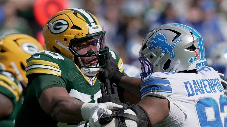 Green Bay Packers offensive tackle Zach Tom (50) blocks Detroit Lions defensive end Marcus Davenport.
