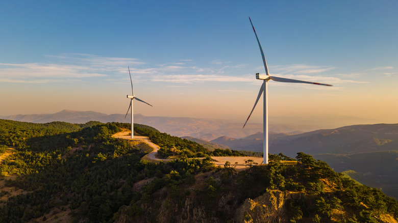 Two wind turbines on a mountain