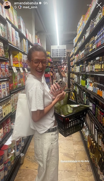 Amanda Batula posing in a grocery store.