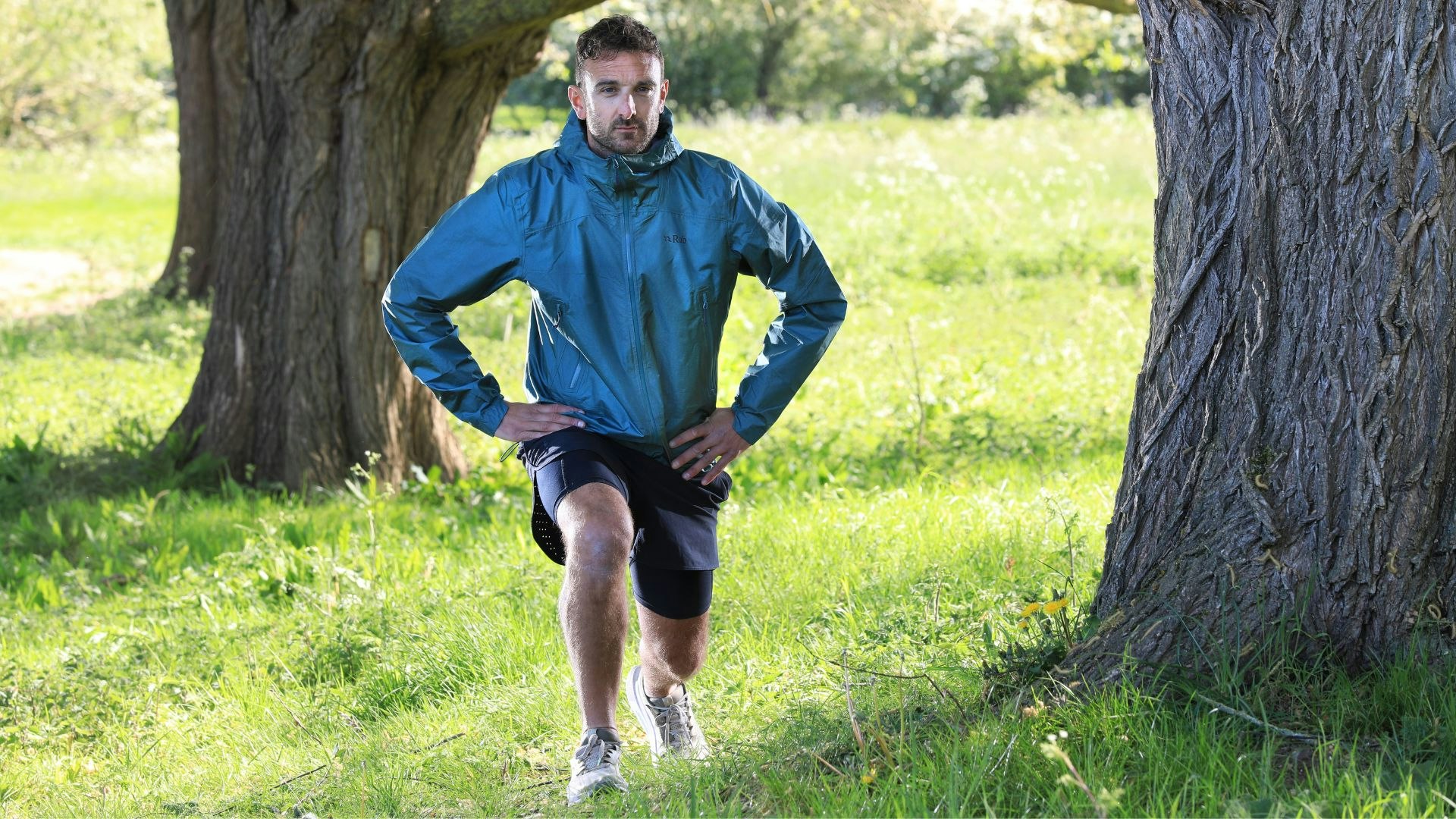 front view of runner wearing rab phantom mountain running jacket