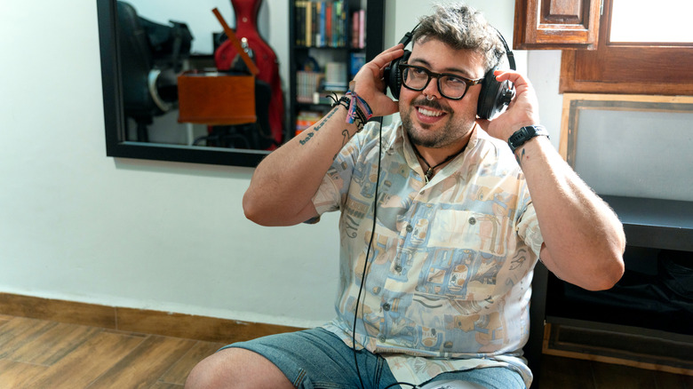 A person wearing headphones while listening to music.