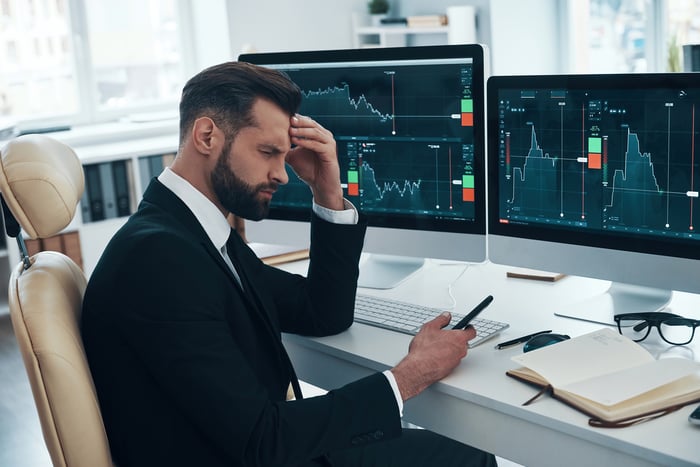 Person with a headache tracking charts.