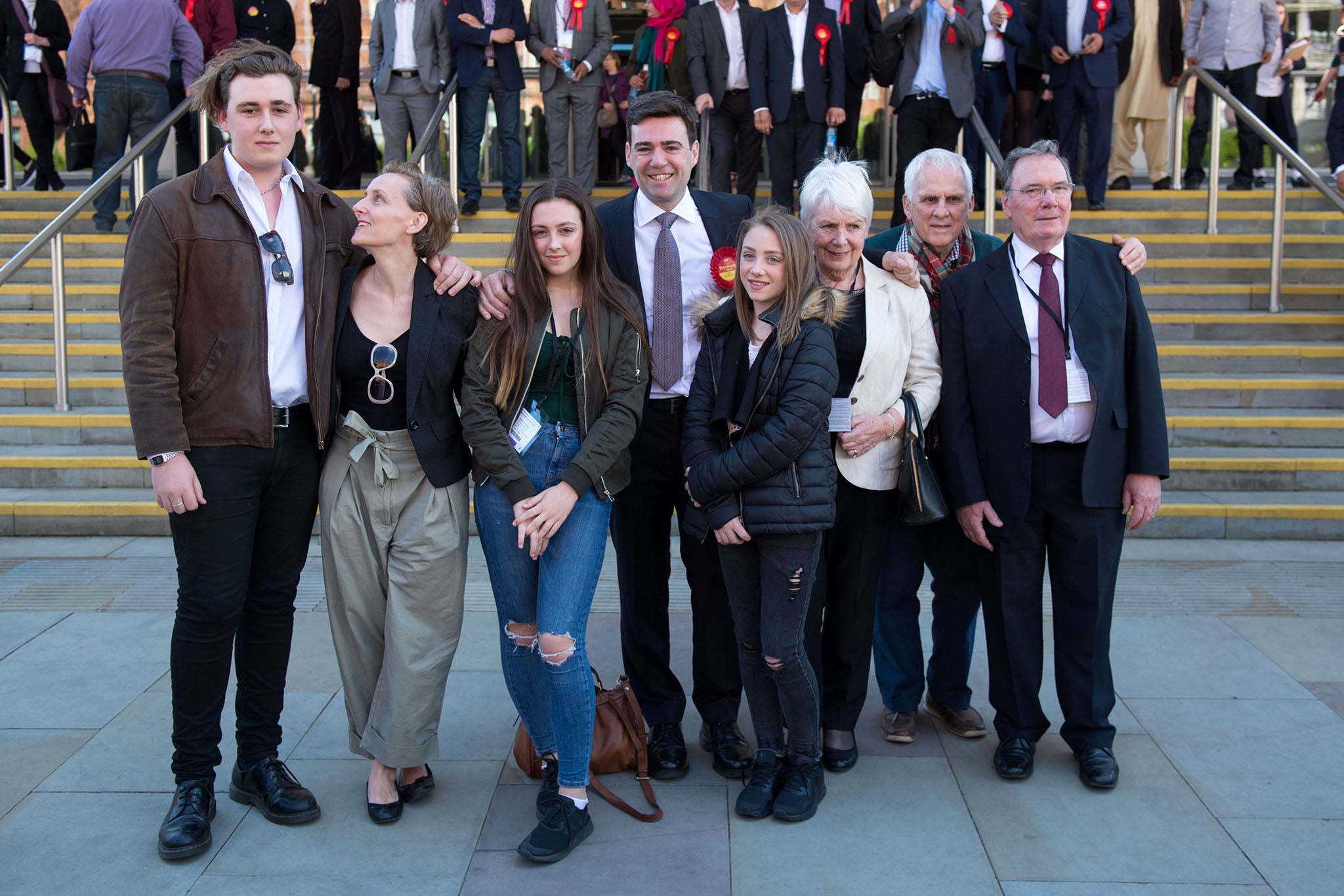 Family man: Burnham with his children and parents in 2017 (AFP/Getty)