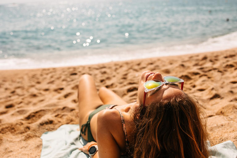 Tanmaxxing, a term that riffs on the self-improvement trend ‘looksmaxxing,’ encourages people to achieve the strongest tan possible by any means necessary — but dermatologists have raised concerns about the trend (Getty/iStock)