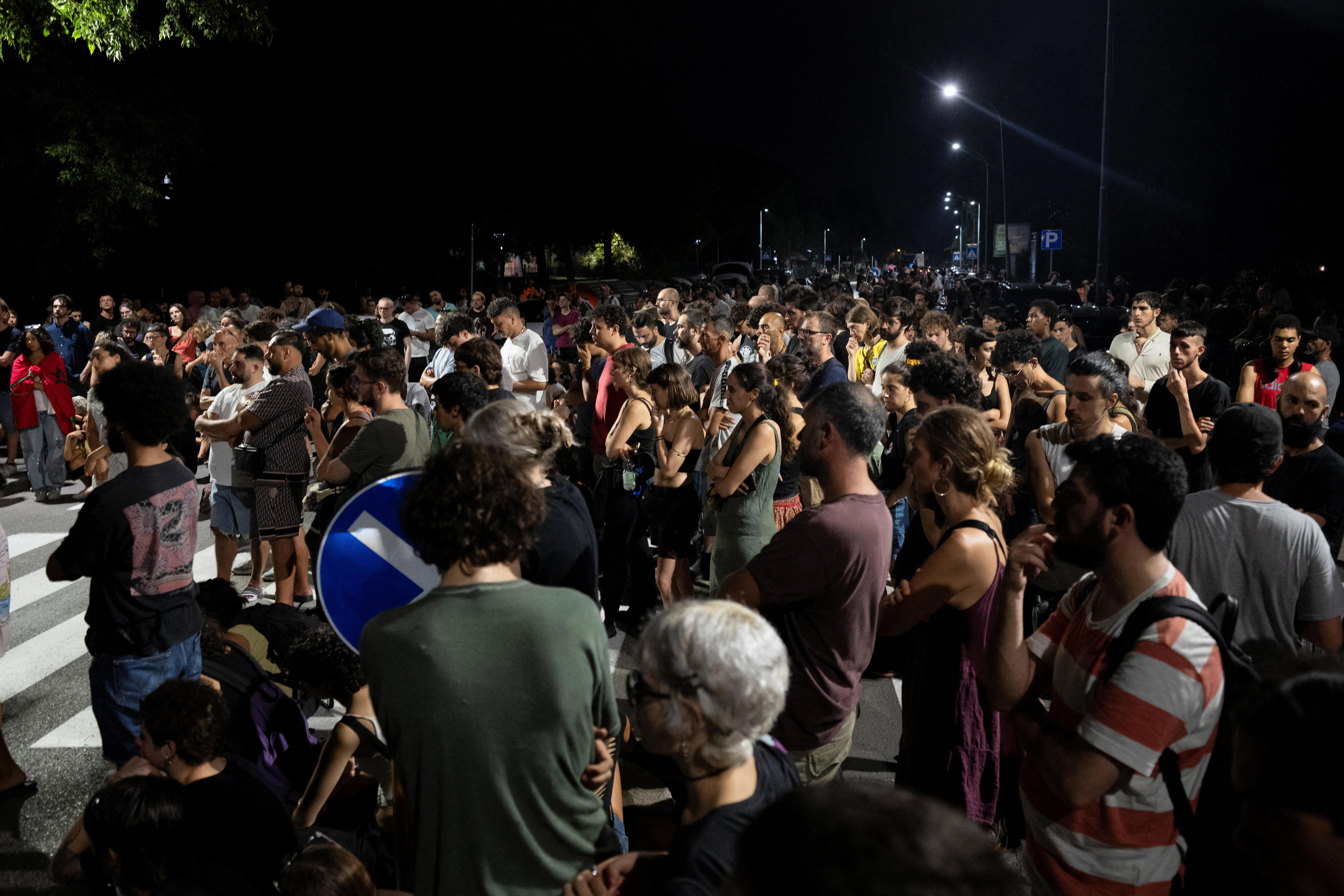 People gather near the scene where Abderrahim Fakir died while being held to the ground by police trying to arrest him in Bologna, Italy, July 19, 2026. / Credit: Reuters/Michele Lapini