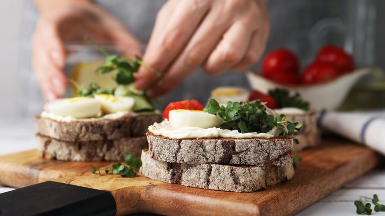 person making sandwich