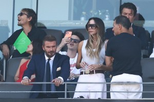 English former footballer David Beckham, singer and designer Victoria Beckahm and Cruz Beckham (C) attend the 2026 World Cup football tournament final match between Spain and Argentina at the New York/New Jersey Stadium in East Rutherford on July 19, 2026. (Photo by CHARLY TRIBALLEAU / AFP)