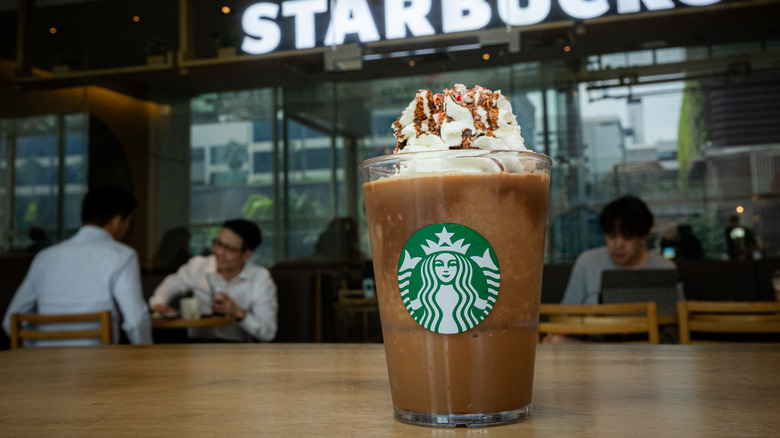 Frappuccino on the counter inside a Starbucks store