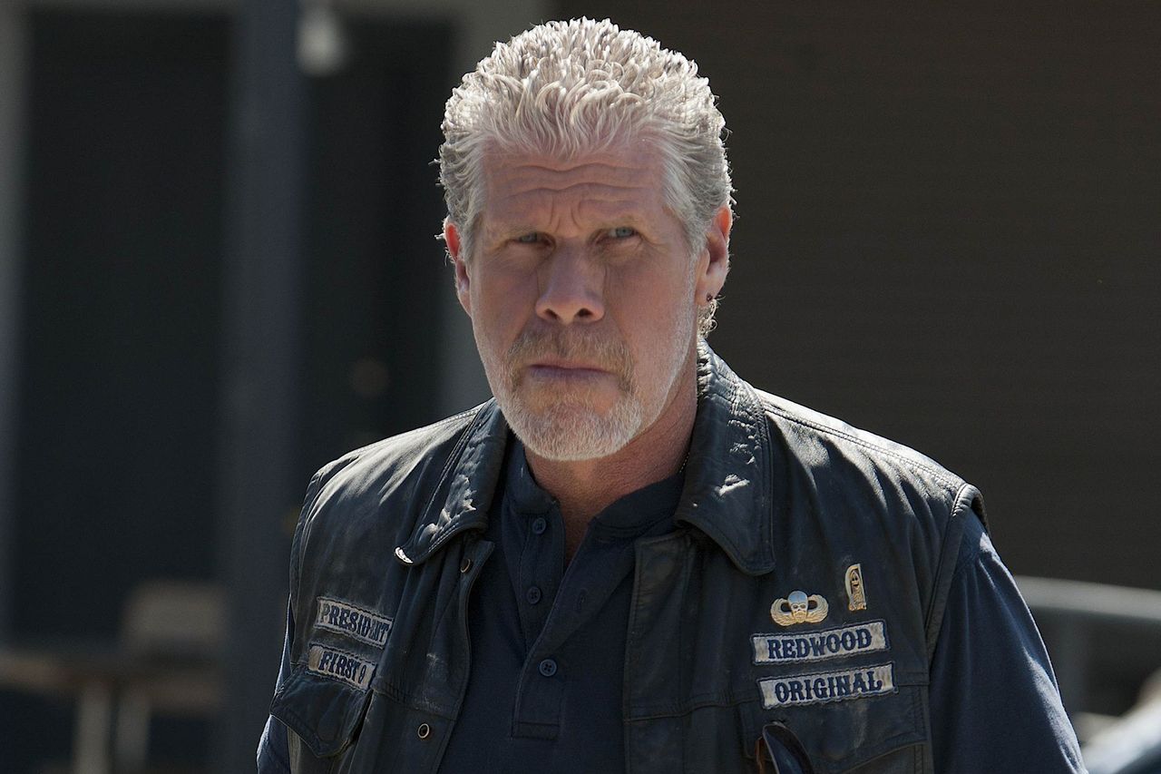 Ron Perlman wearing a biker vest with patches