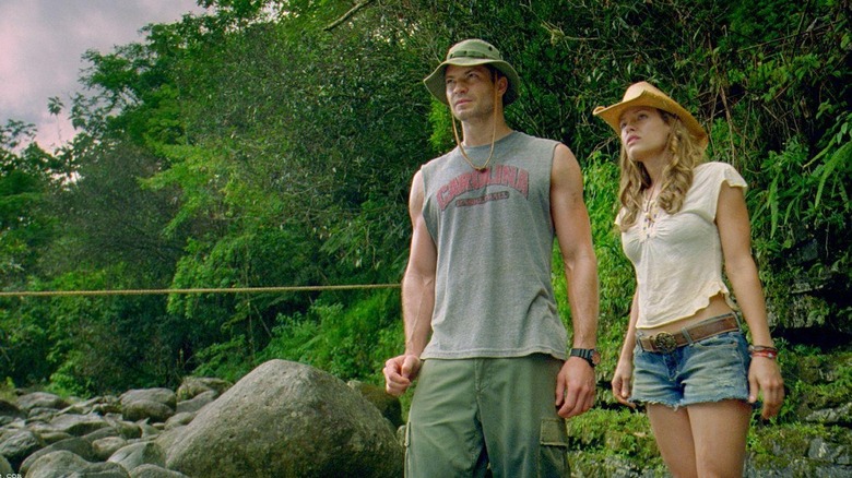 Nick and Gina outdoors in a rocky area in A Perfect Getaway