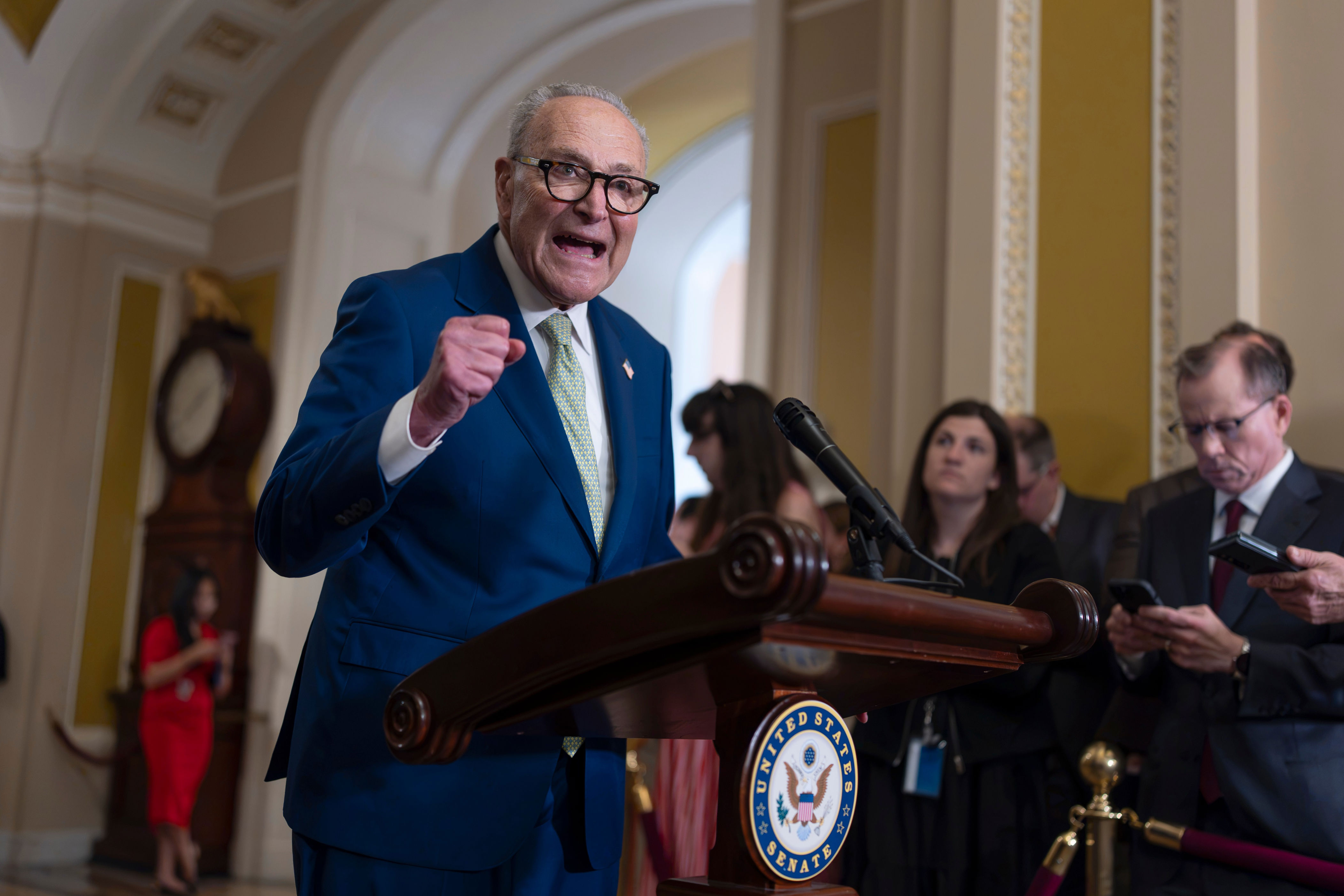 Senate Minority Leader Chuck Schumer, D-N.Y., speaks with reporters after a closed-door policy meeting, at the Capitol in Washington, Wednesday, July 15, 2026. (AP Photo/J. Scott Applewhite)