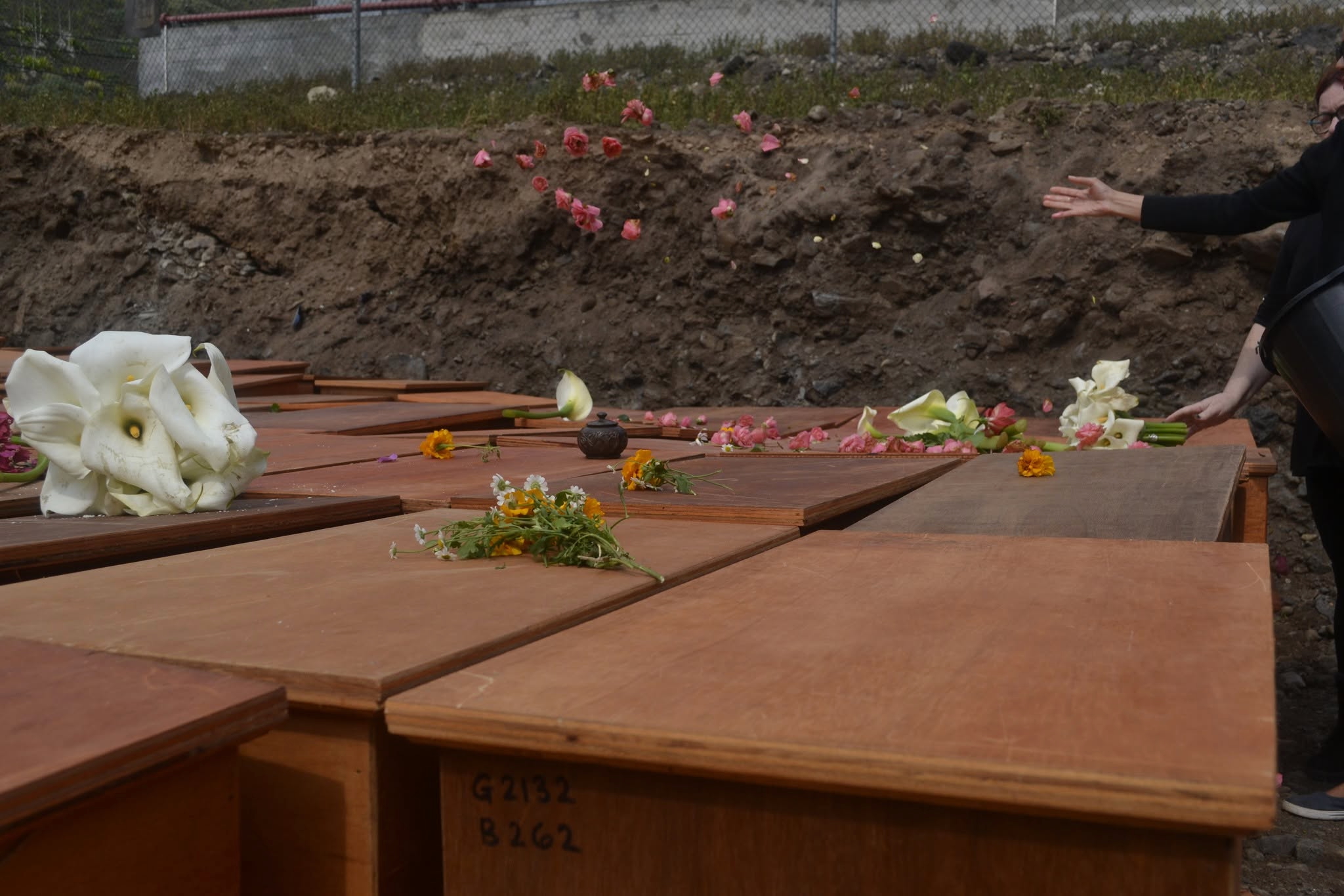 The exumed remains were reburied in caskets in 2022.