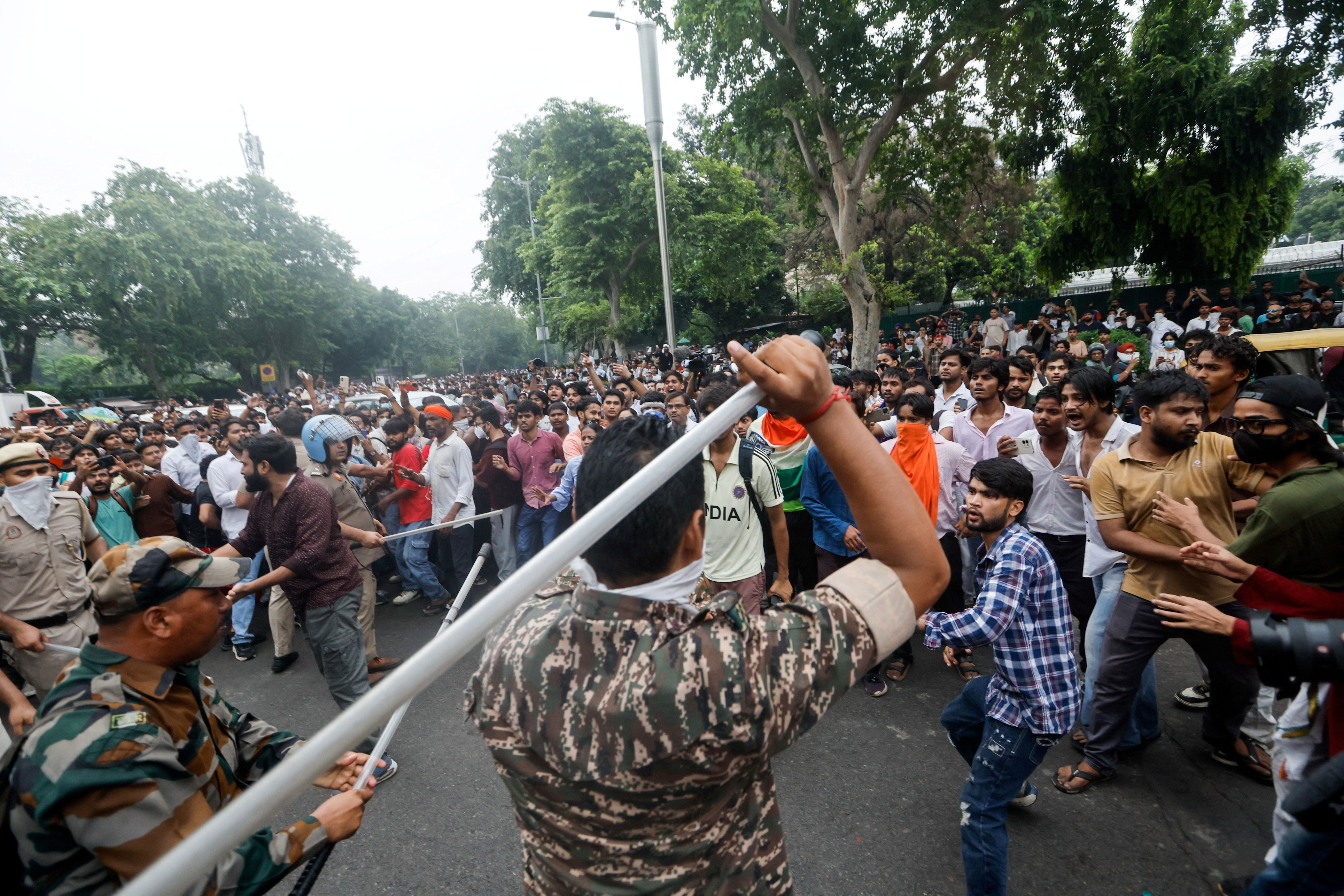 Police use batons to disperse the crowd (Reuters)