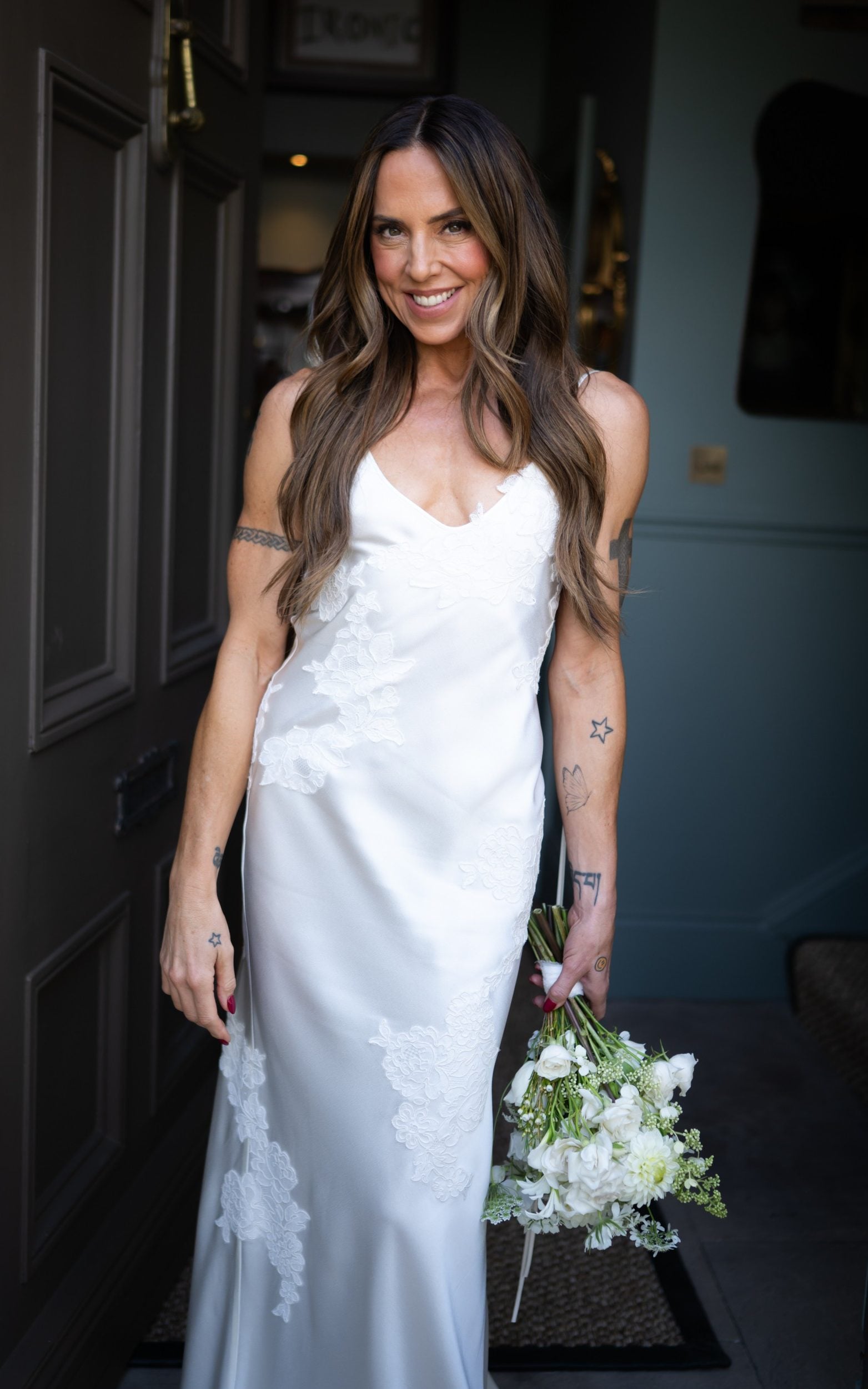 The bespoke wedding dress featured delicately dyed vintage lace, an open back and a slip-inspired silhouette