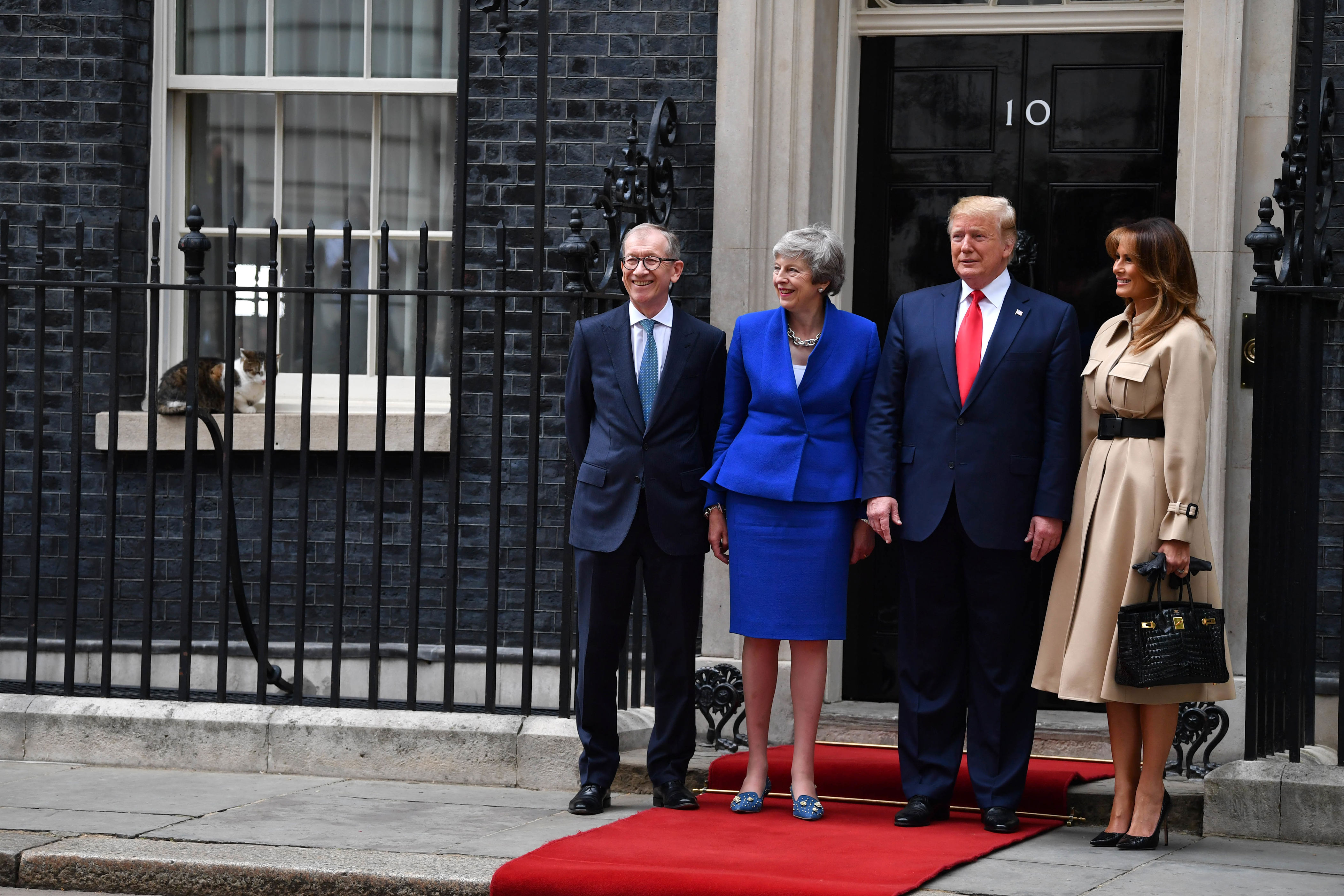Prime Minister Theresa May and husband Philip May welcome US President Donald Trump and First Lady Melania Trump to 10 Downing Street as Larry the Cat sits on the window ledge, during the second day of his State Visit on June 4, 2019 in London, England.