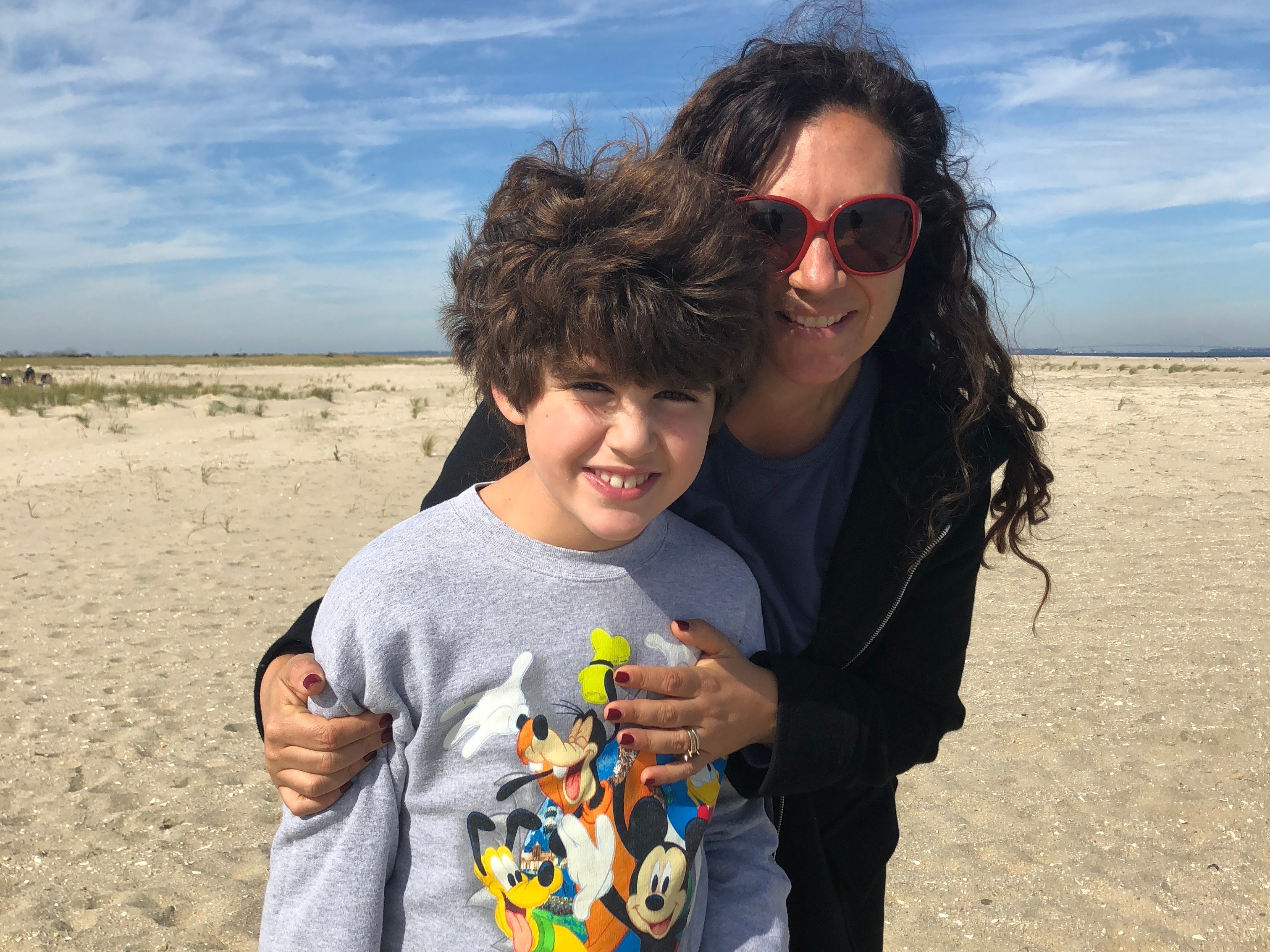 Woman posingwith her son outside