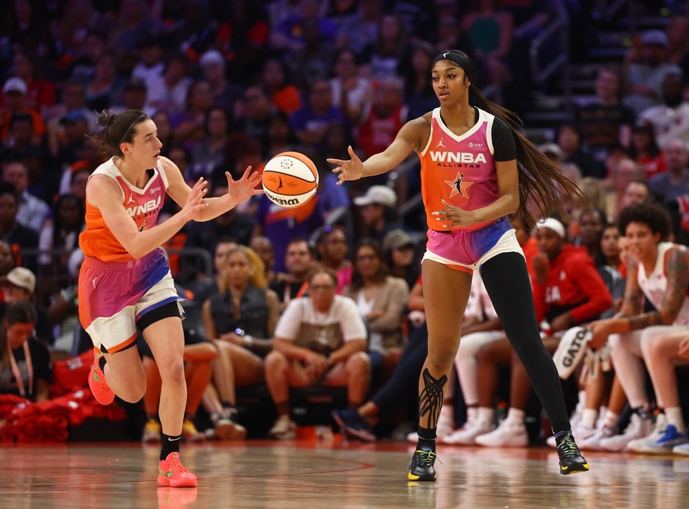 Jul 20, 2024; Phoenix, AZ, USA; Team WNBA guard Caitlin Clark (left) and Angel Reese against the USA Women's National Team during the 2024 WNBA All Star Game at Footprint Center. Mandatory Credit: Mark J. Rebilas-Imagn Images