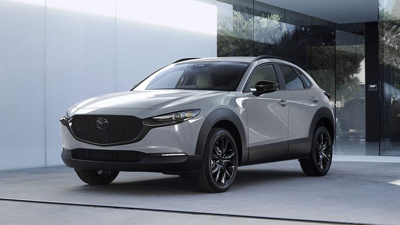 A white 2026 Mazda CX-30 in front of a building.