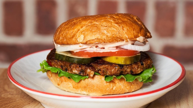 Park Burger's veggie burger with lettuce, tomato, onion, and pickles on a brioche bun