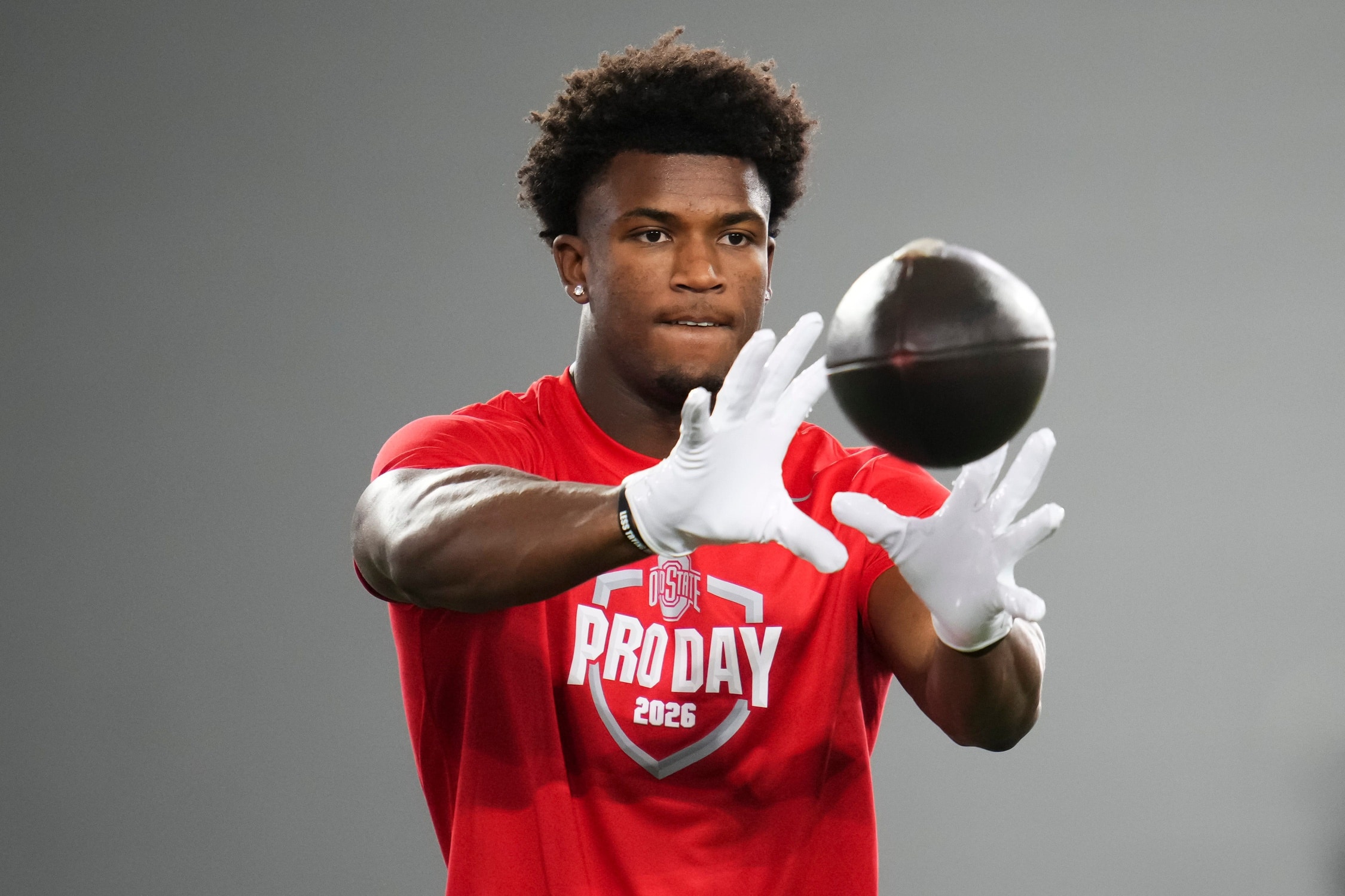 Ohio State Buckeyes defensive back Caleb Downs catches a ball during Pro Day for NFL scouts.