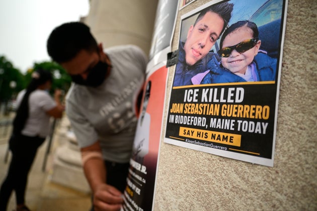 Organizers with immigrant rights group Unidad Latina en Acción taped flyers to the pillars of the federal courthouse in New Haven, Conn., on July 15, 2026, before a protest against the recent ICE shooting of Joan Sebastián Guerrero in Biddeford, Maine.