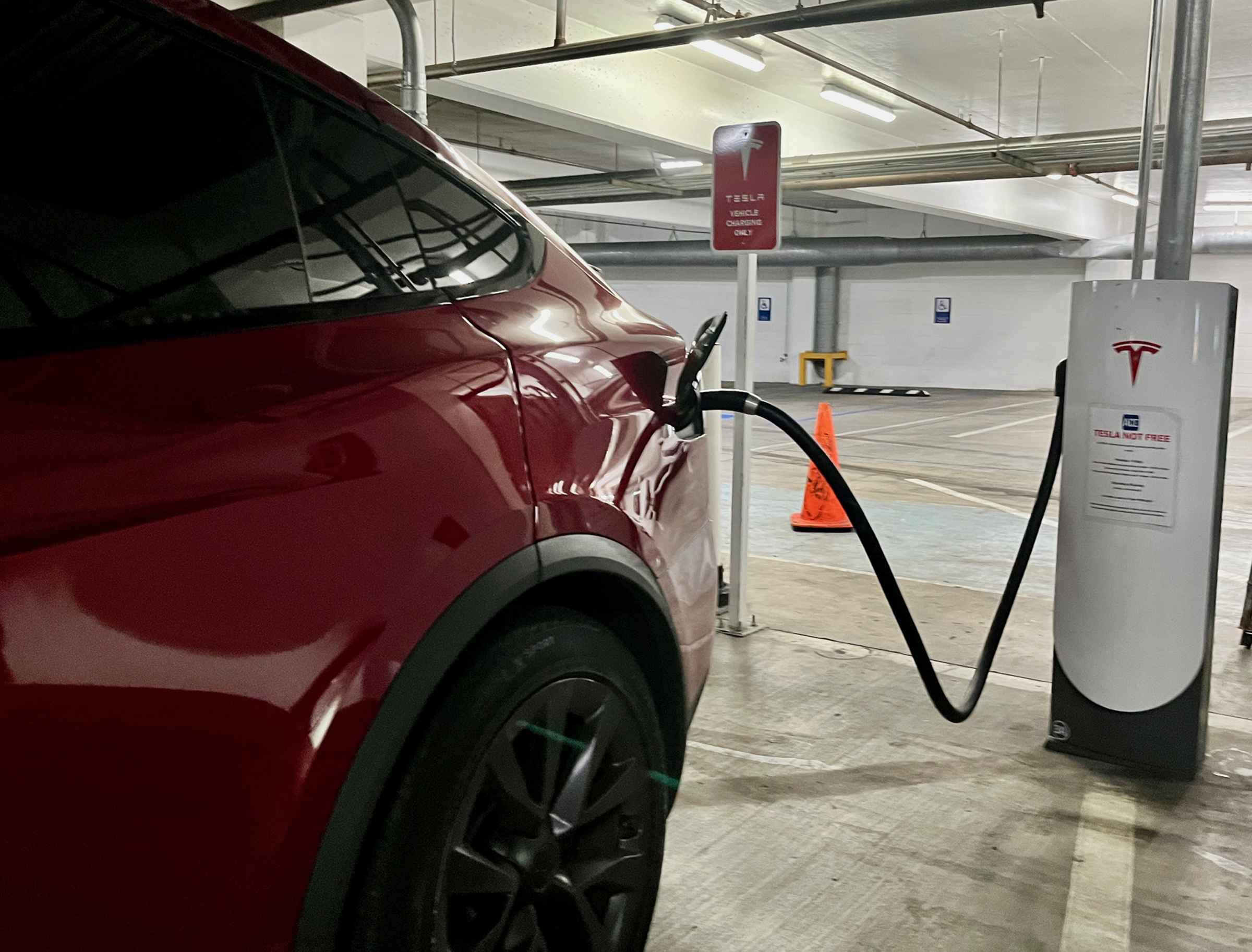 A Tesla fast-charging station at an indoor parking lot on the corner of Sixth Avenue and A Street in downtown San Diego.