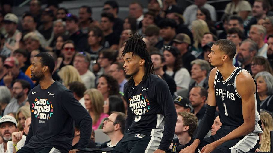 San Antonio Spurs forward Victor Wembanyama (1), guard Stephon Castle (5) and forward Harrison Barnes (40) wait.