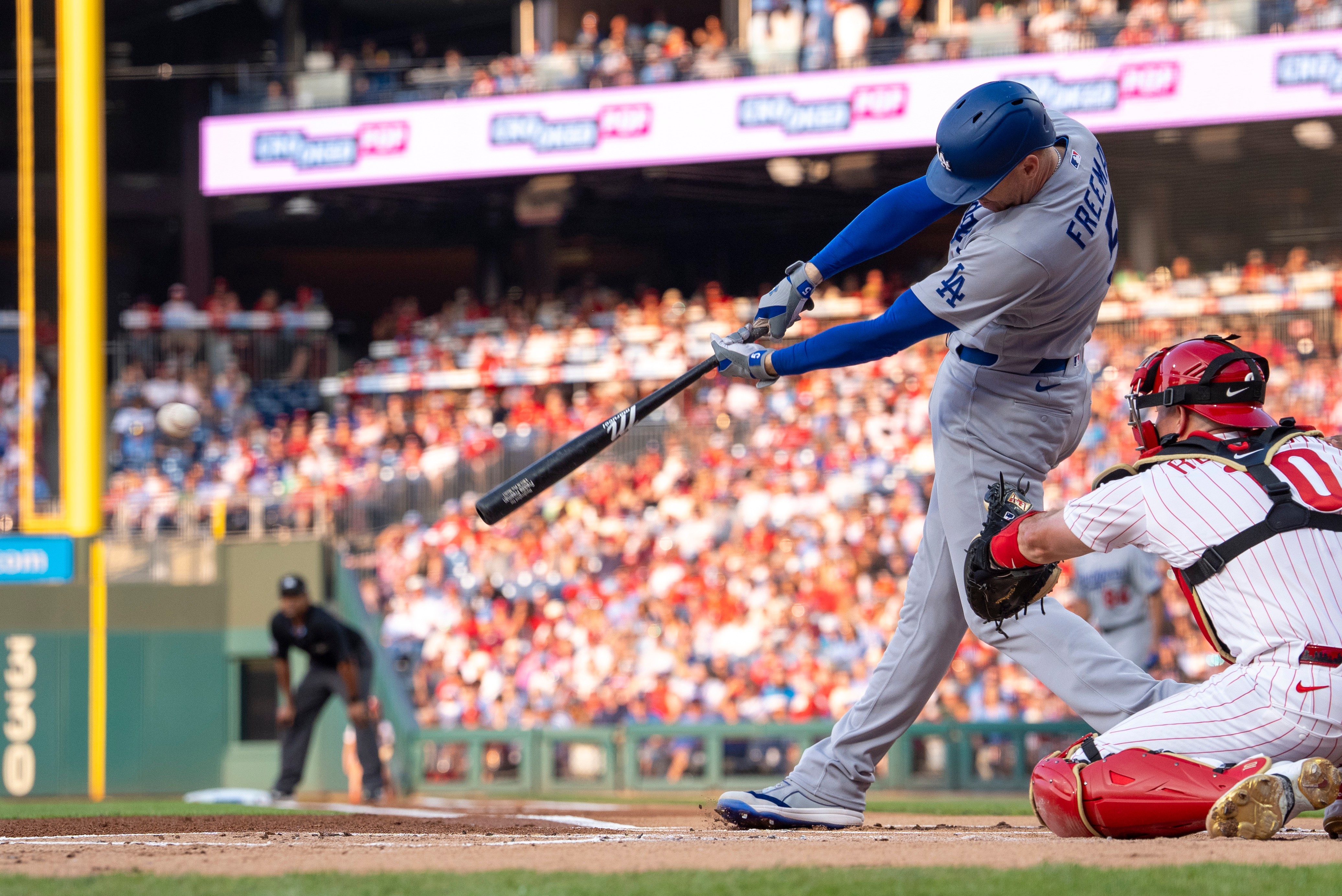 Los Angeles Dodgers' Freddie Freeman hits a single during the first inning of a baseball game against the Philadelphia Phillies, Monday, July 20, 2026, in Philadelphia. (AP Photo/Chris Szagola)