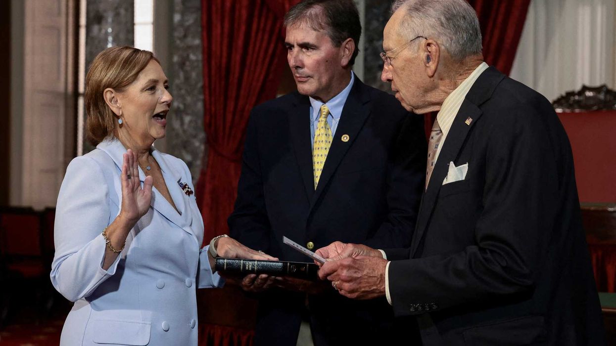 U.S. Senator for South Carolina Darline Graham Nordone, sister of late Senator Lindsey Graham, is ceremonially sworn-in by U.S. Senate President pro tempore Chuck Grassley (R-IA) next to her husband Larry Nordone during an event on Capitol Hill in Washington, D.C., U.S., July 14, 2026. REUTERS/Evelyn Hockstein TPX IMAGES OF THE DAY