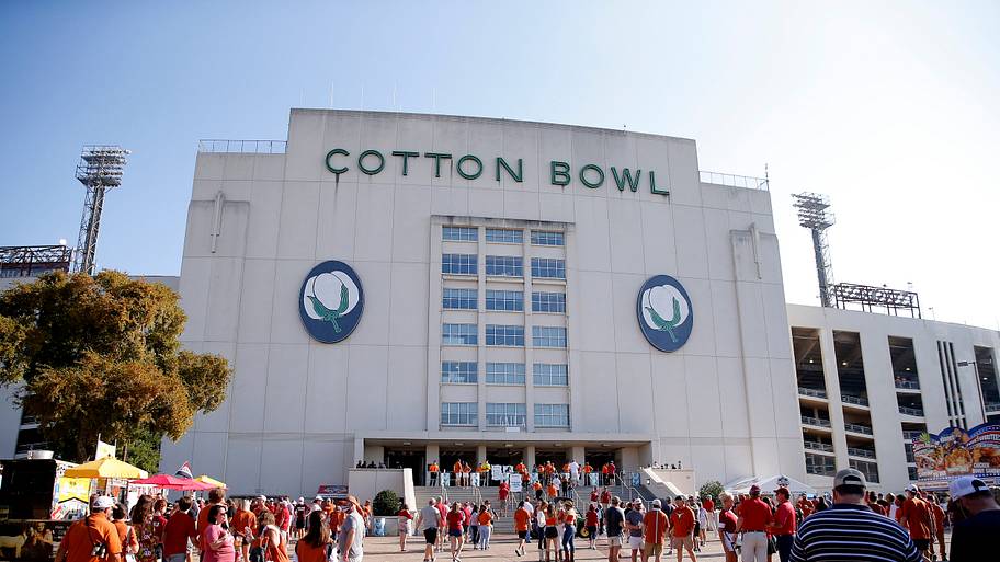 Fans walk outside Cotton Bowl Stadium