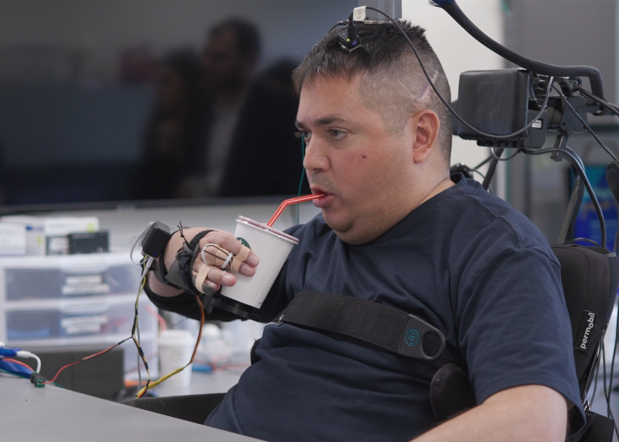Keith Thomas is now able to grasp, lift and drink from a cup on his own.