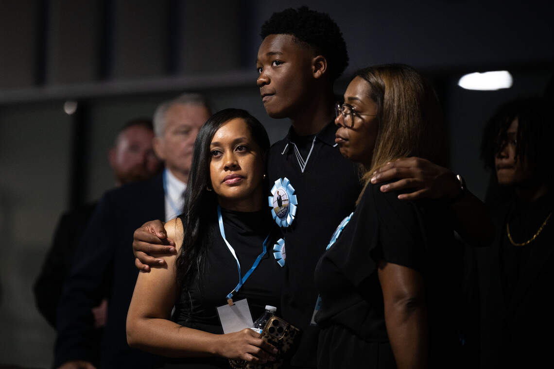 Attendees hold each other in their arms during a funeral service for Nolan Wells at Center Pointe Church in Ocean Springs.