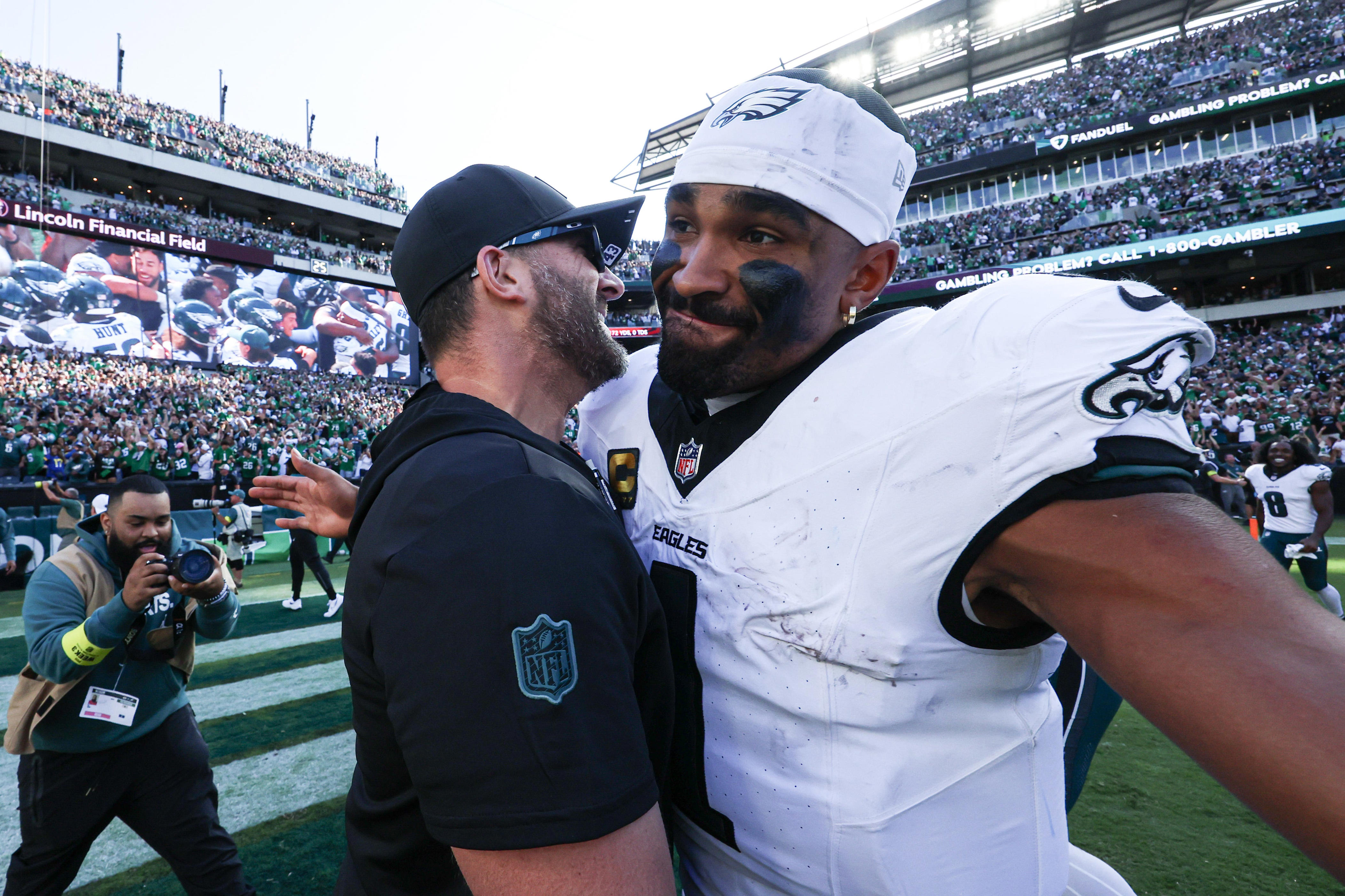 Sep 21, 2025; Philadelphia, Pennsylvania, USA; Philadelphia Eagles quarterback Jalen Hurts (1) and head coach Nick Sirianni celebrate after a victory against the Los Angeles Rams at Lincoln Financial Field. Mandatory Credit: Bill Streicher-Imagn Images