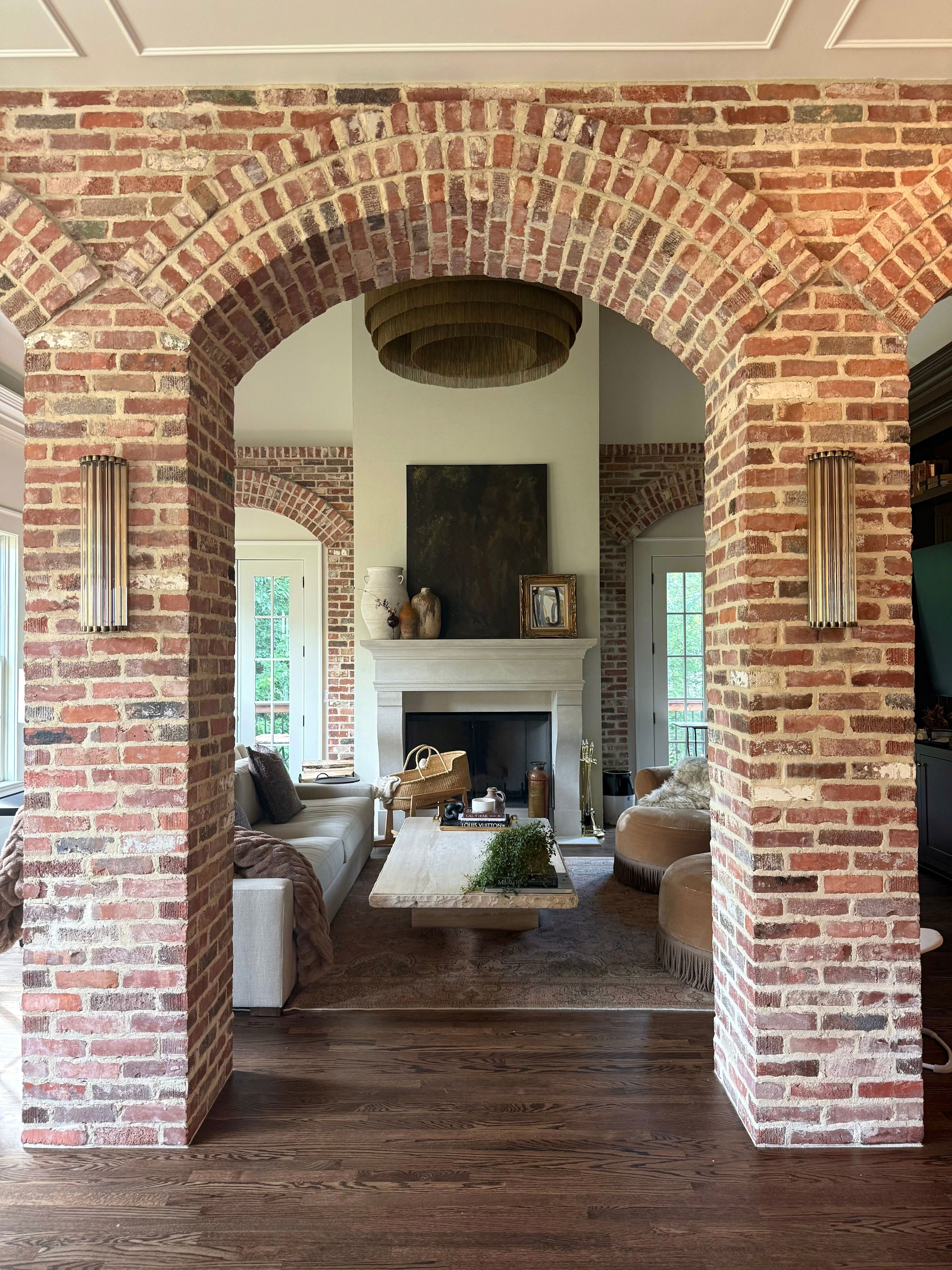 Loren and Sean Rosko used reclaimed brick to create a series of arches throughout their home.
