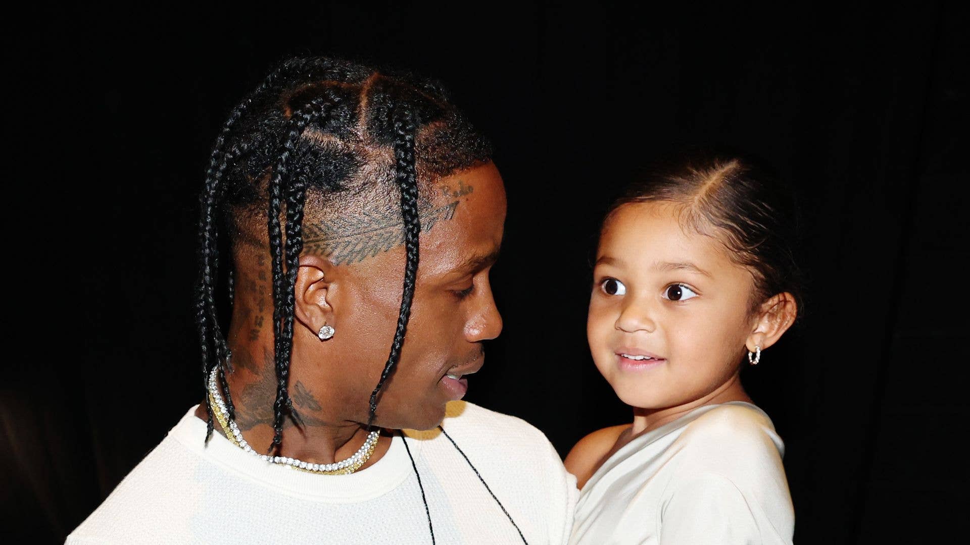 Travis Scott's mini-me daughter Stormi turns surprise stage appearance into playful family rivalry during rare public outing