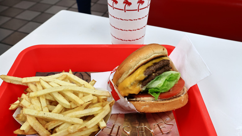 A tray with an In-N-Out burger and fries