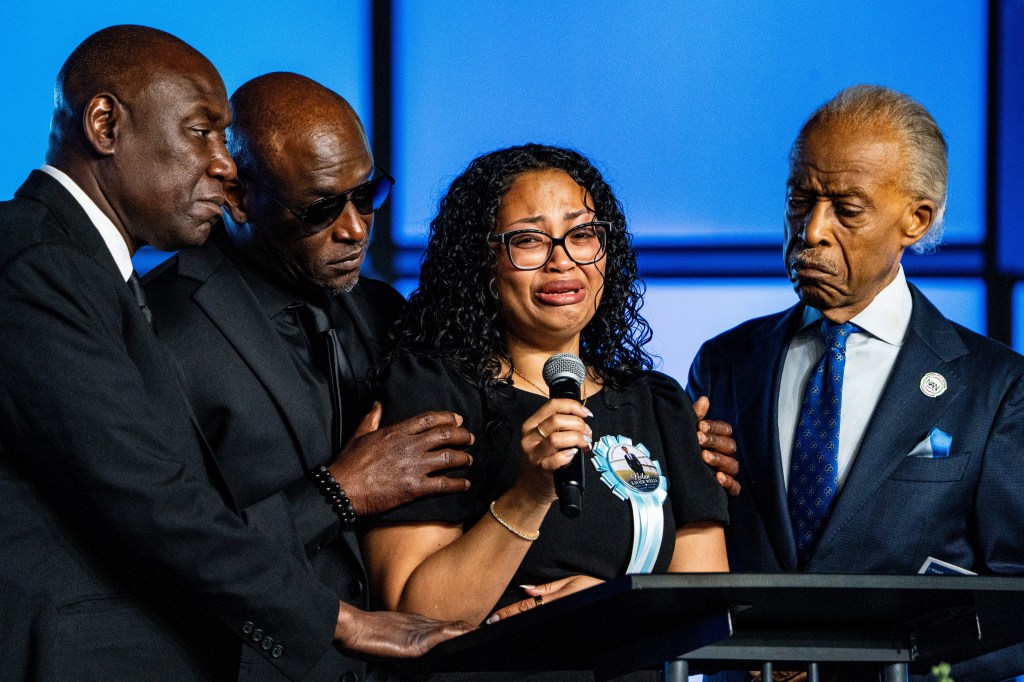 Christine Wonsley, Nolan Wellss mother, speaks while being consoled by attorney Ben Crump, Wellss father Elmore Wonsley and