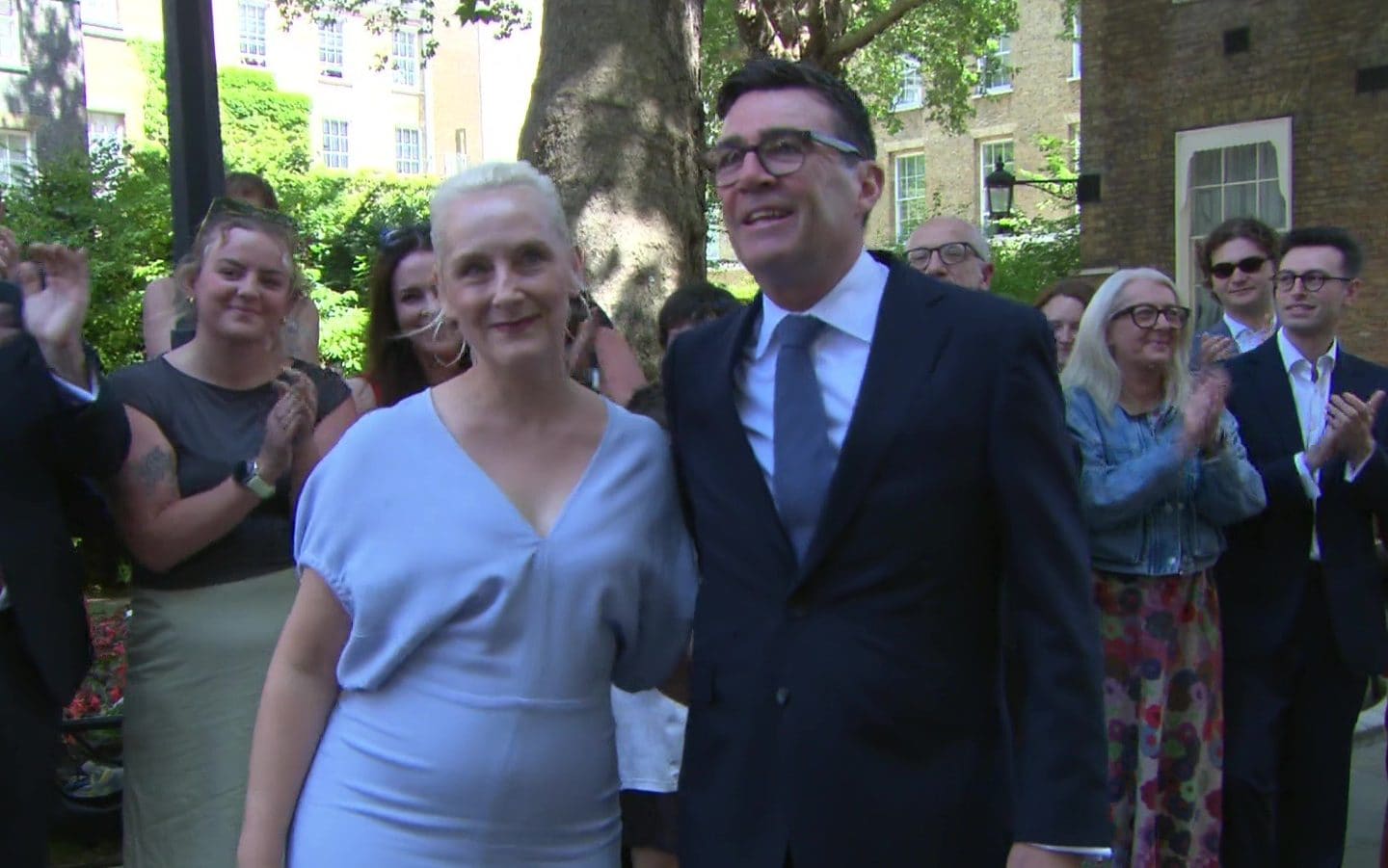 Burnham and his wife arriving at No 10