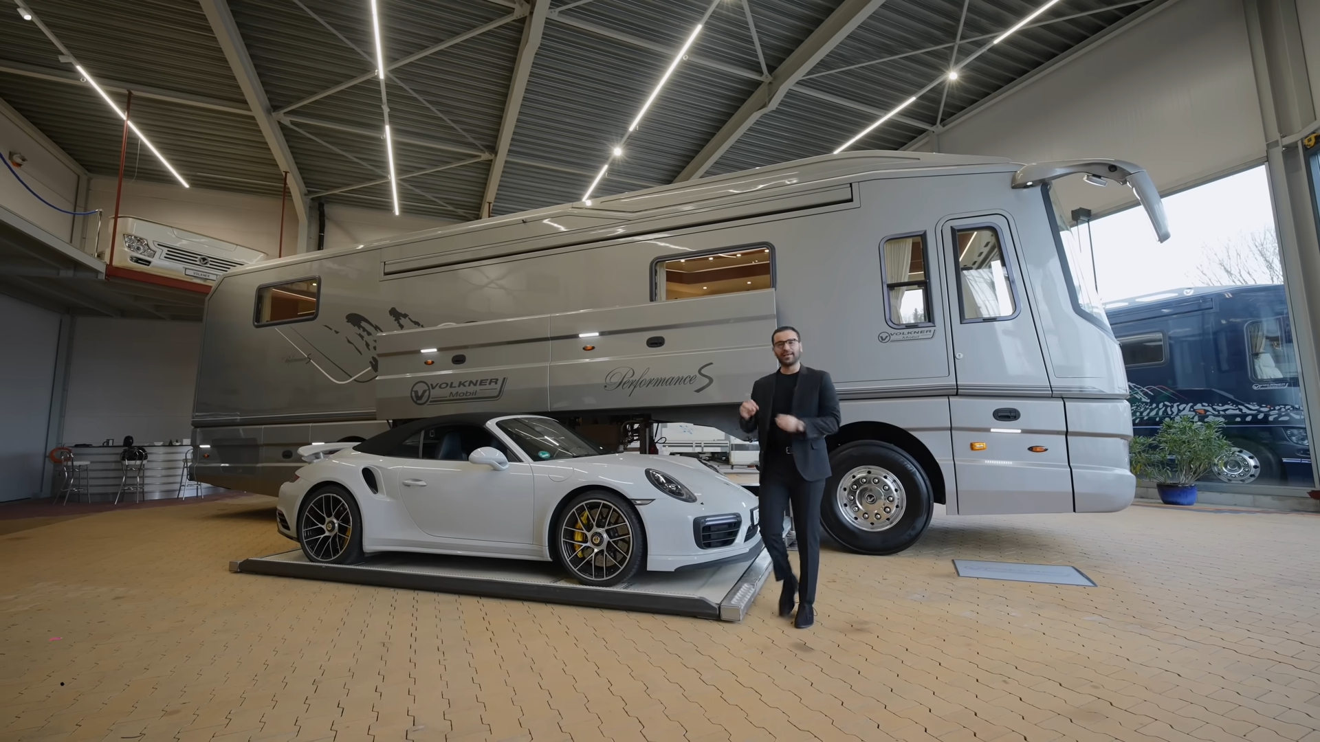 This $2 million motorhome hides a supercar garage inside