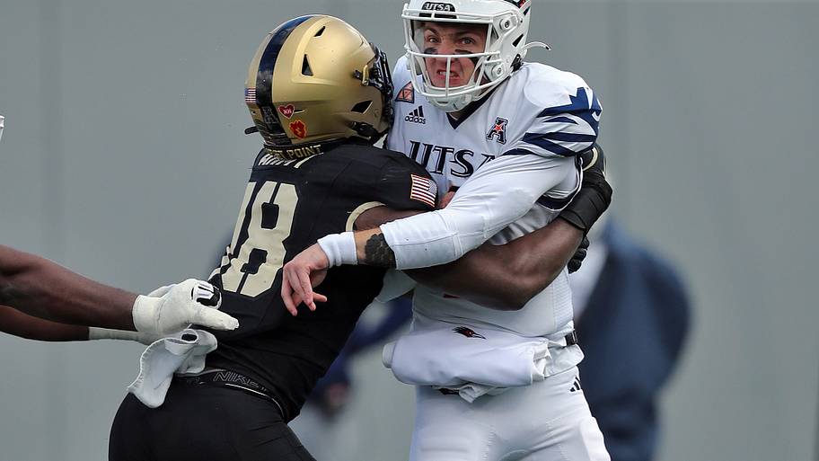 UTSA Roadrunners quarterback Owen McCown (2) gets hit by Army Black Knights linebacker Elo Modozie (18).