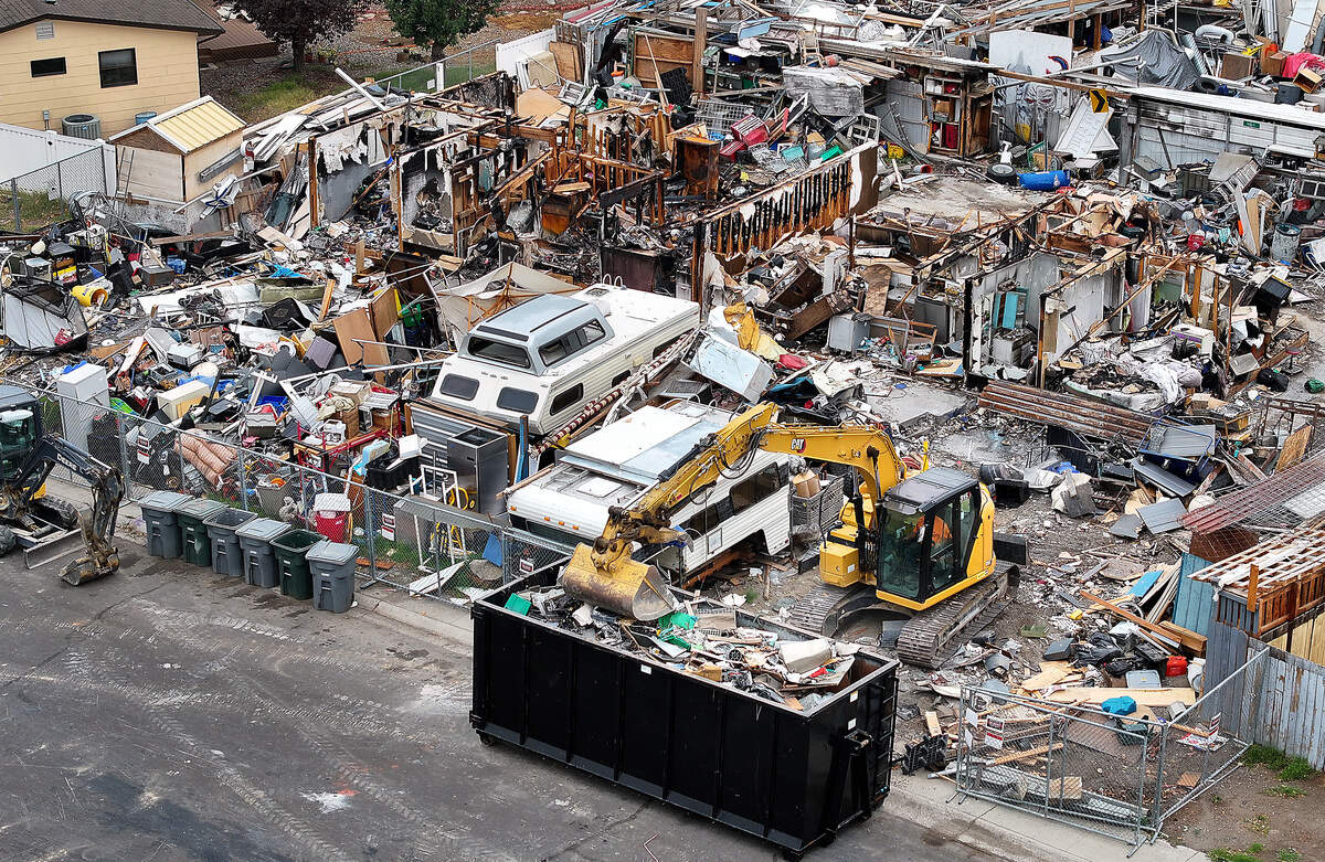 City digs in at Richland 'junkyard' house. Owner makes plea to save items