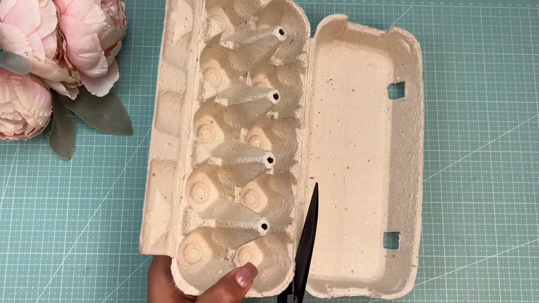Transform old egg cartons into chic decor with a thrifted mirror