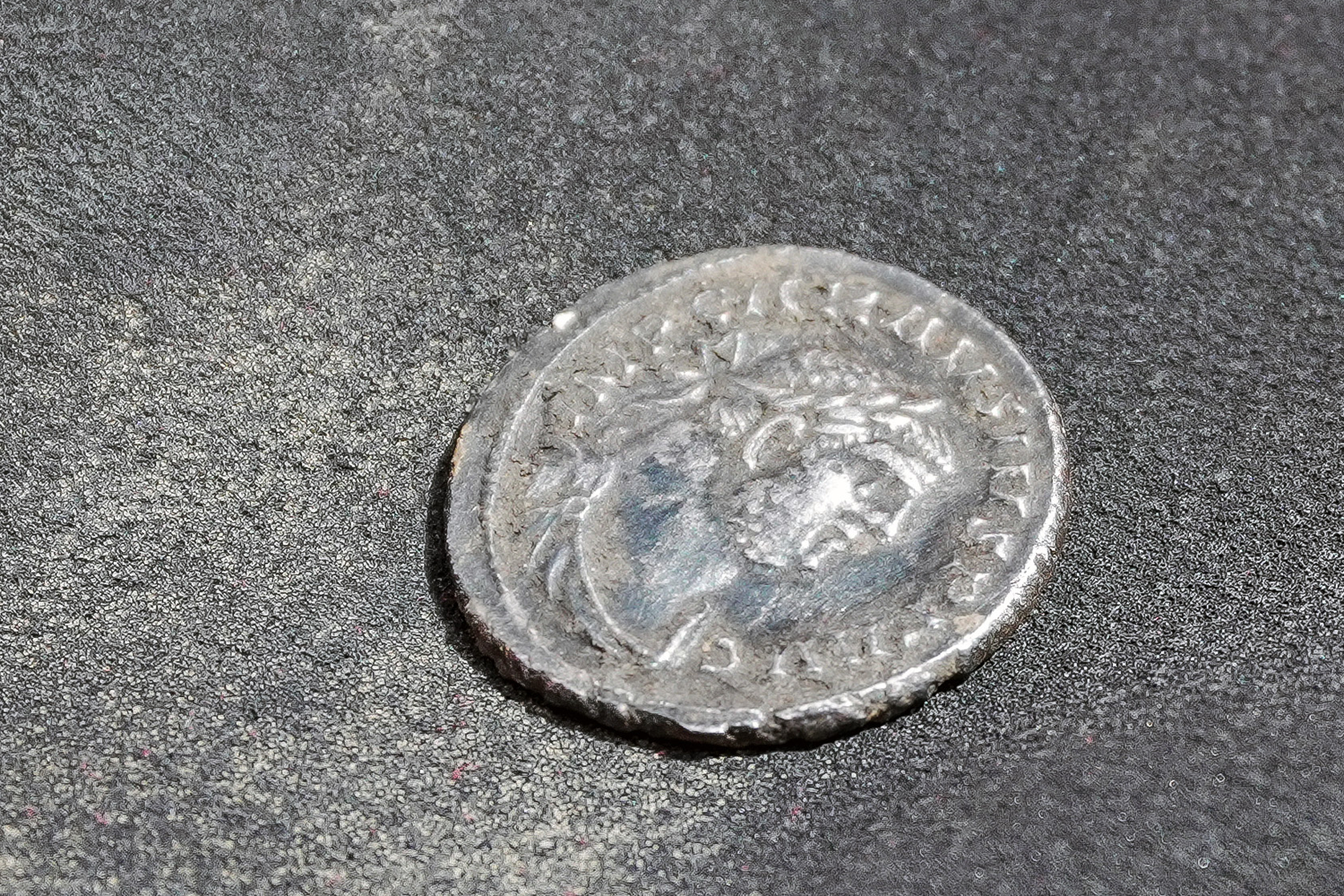 Minted by Carausius, this silver denarius is dated to 287 C.E.