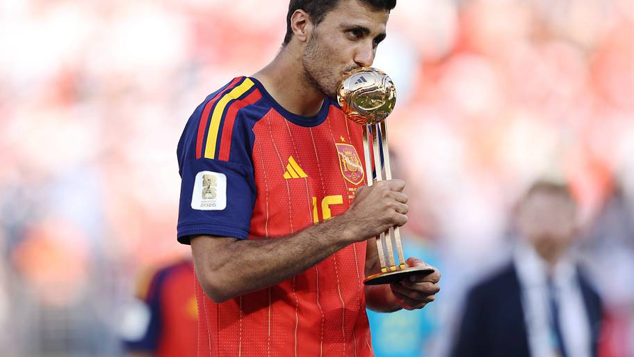Rodri kissing the trophy.