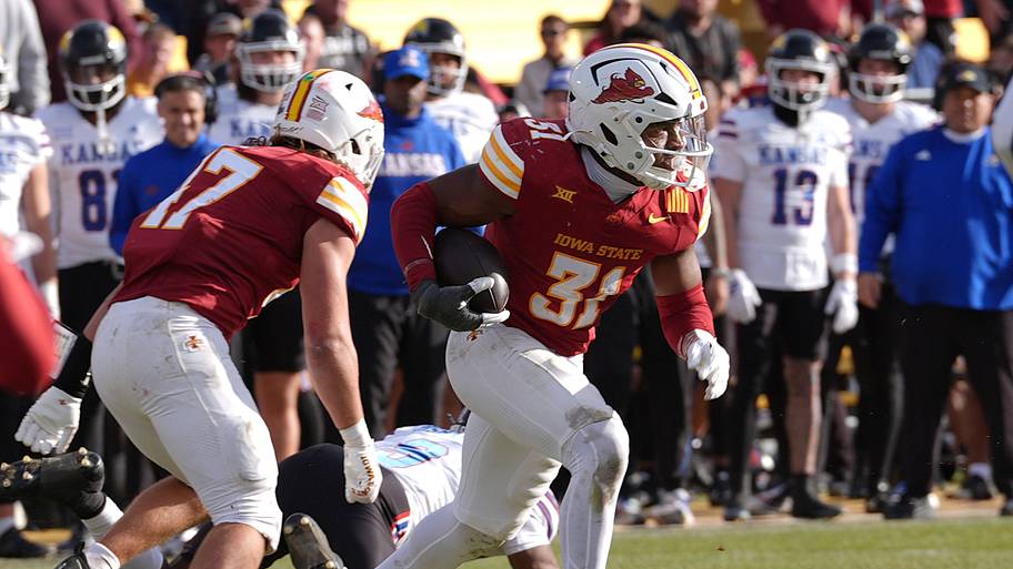 Iowa State Cyclones' defensive back Marcus Neal Jr.(31) runs with the ball after a interception against Kansas.