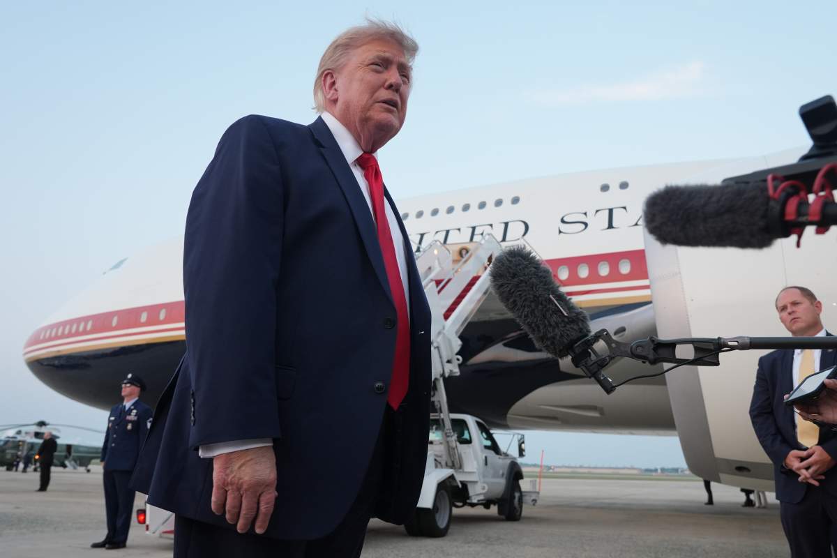President Donald Trump speaks to reporters as he exits Air Force One at Joint Base Andrews, Md., after attending the World Cup final soccer match, Sunday, July 19, 2026. (AP Photo/Jacquelyn Martin)