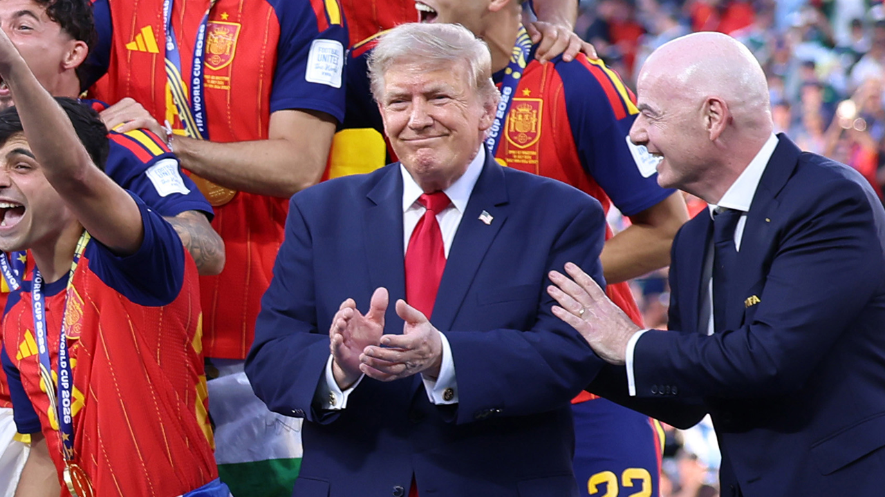 FIFA President Gianni Infantino (right) with President Donald Trump as Spain lifts the FIFA World Cup trophy after the FIFA World Cup 2026 Final match at New York New Jersey Stadium on July 19, 2026 in East Rutherford, New Jersey.