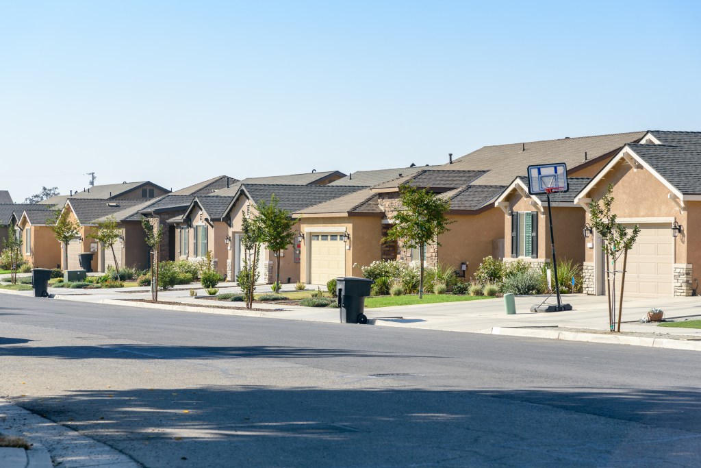 new-detached-houses-along-street-135042805